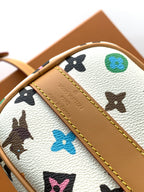 Louis Vuitton mini handbag close-up of logo embossing on tan leather trim