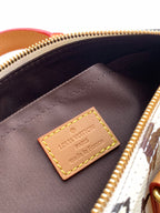 Louis Vuitton mini handbag interior lining with tan Louis Vuitton label and zipper edge