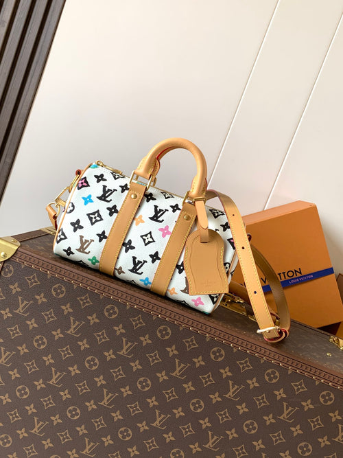 Louis Vuitton mini handbag with white monogram print and tan leather handles