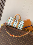 Louis Vuitton mini handbag with white monogram print and tan crossbody strap