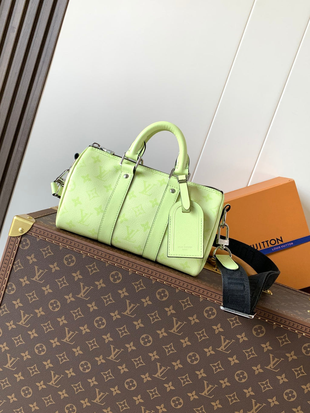 Louis Vuitton green leather handbag with top handles and shoulder strap