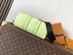 Louis Vuitton green leather handbag side view with strap and folded panel detail