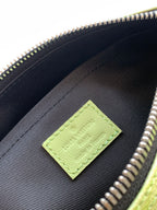 Louis Vuitton green logo patch on black fabric lining inside the bag