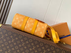 Louis Vuitton monogram canvas bag with yellow side straps and long shoulder strap