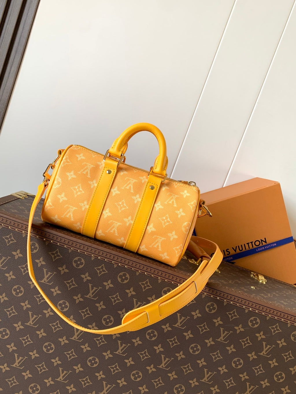 Louis Vuitton monogram duffel bag with yellow strap and short top handles