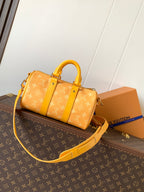 Louis Vuitton monogram duffel bag with yellow strap and short top handles