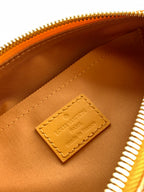Louis Vuitton monogram bag interior label in tan leather with stitched edge