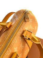 Louis Vuitton monogram small bag with zippered top and yellow leather strap
