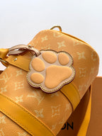 Louis Vuitton monogram mini bag with embossed paw patch and gold-toned hardware