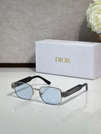Sunglasses with silver frame and light blue lenses, black temple tips