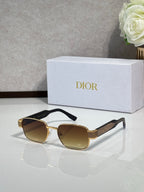 Sunglasses with gold frame and dark gray lenses, round cat-eye shape
