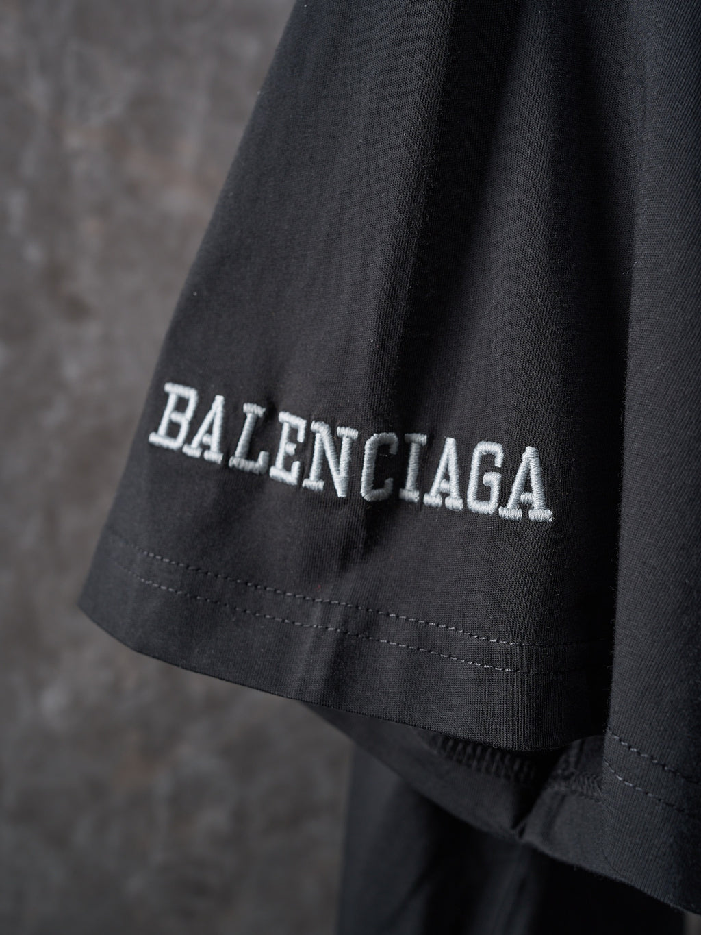 Balenciaga black T-shirt with BALENCIAGA text on sleeve hem