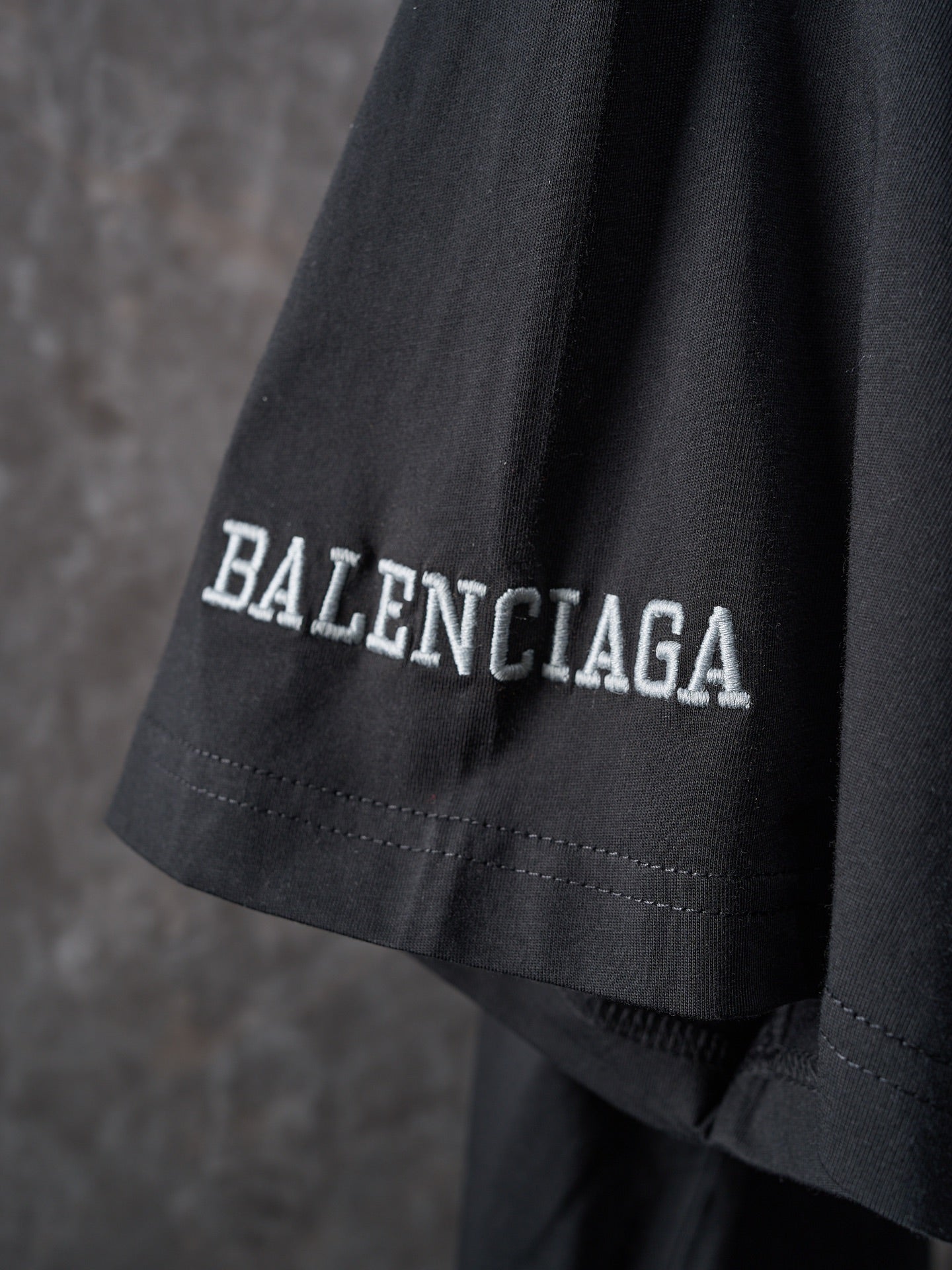 Balenciaga black T-shirt with BALENCIAGA text on sleeve hem