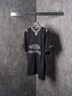 Balenciaga black short-sleeve T-shirt with shield emblem at neckline and logo print