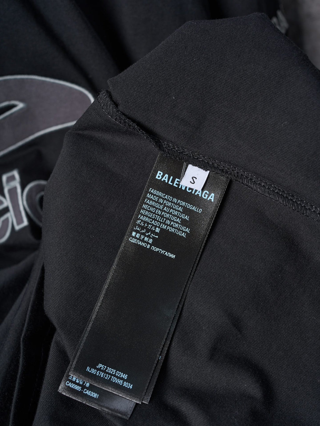 Balenciaga black T-shirt with size label and fabric care tag