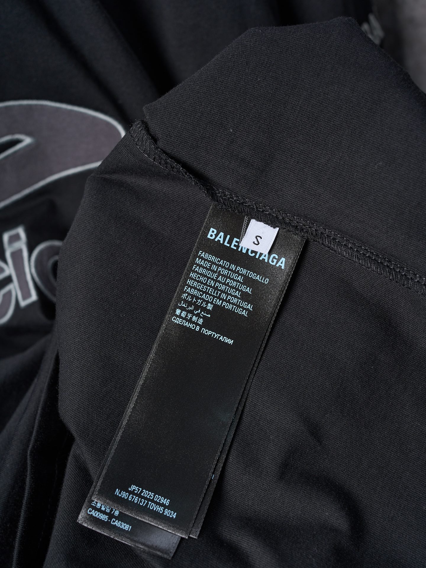 Balenciaga black T-shirt with size label and fabric care tag