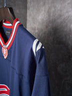 Balenciaga navy jersey side view with red and white trim and BALEN print