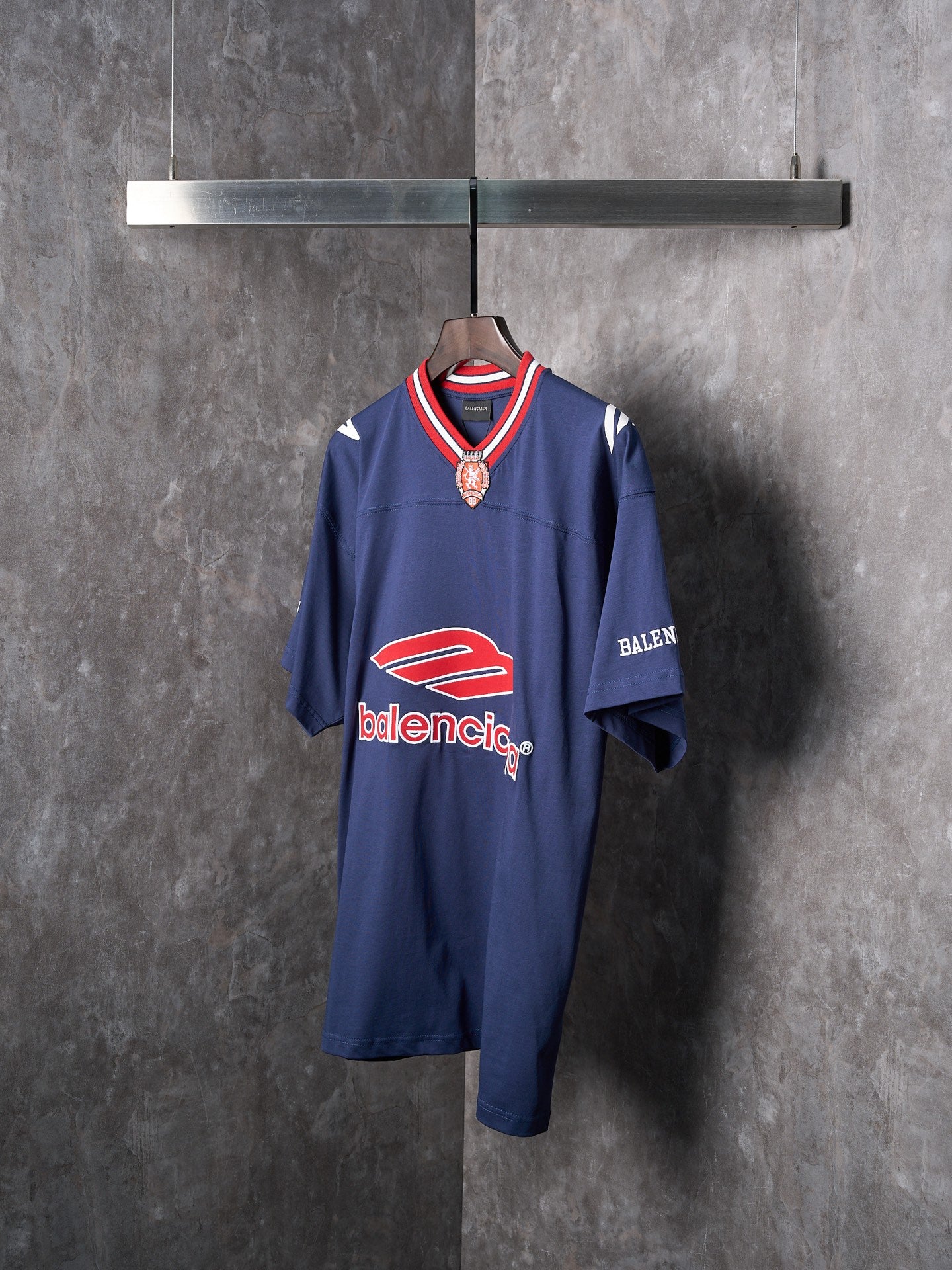 Balenciaga navy short-sleeve jersey with V-neck rib trim and crest badge