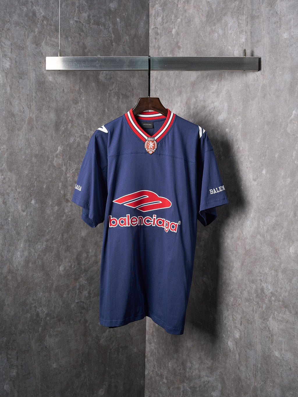 Balenciaga navy short-sleeve jersey with red and white trim and crest logo