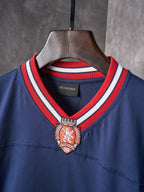 Balenciaga navy jersey collar with red and white rib trim and crest emblem