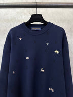 Louis Vuitton sweater front, dark navy knit with scattered small animal patches