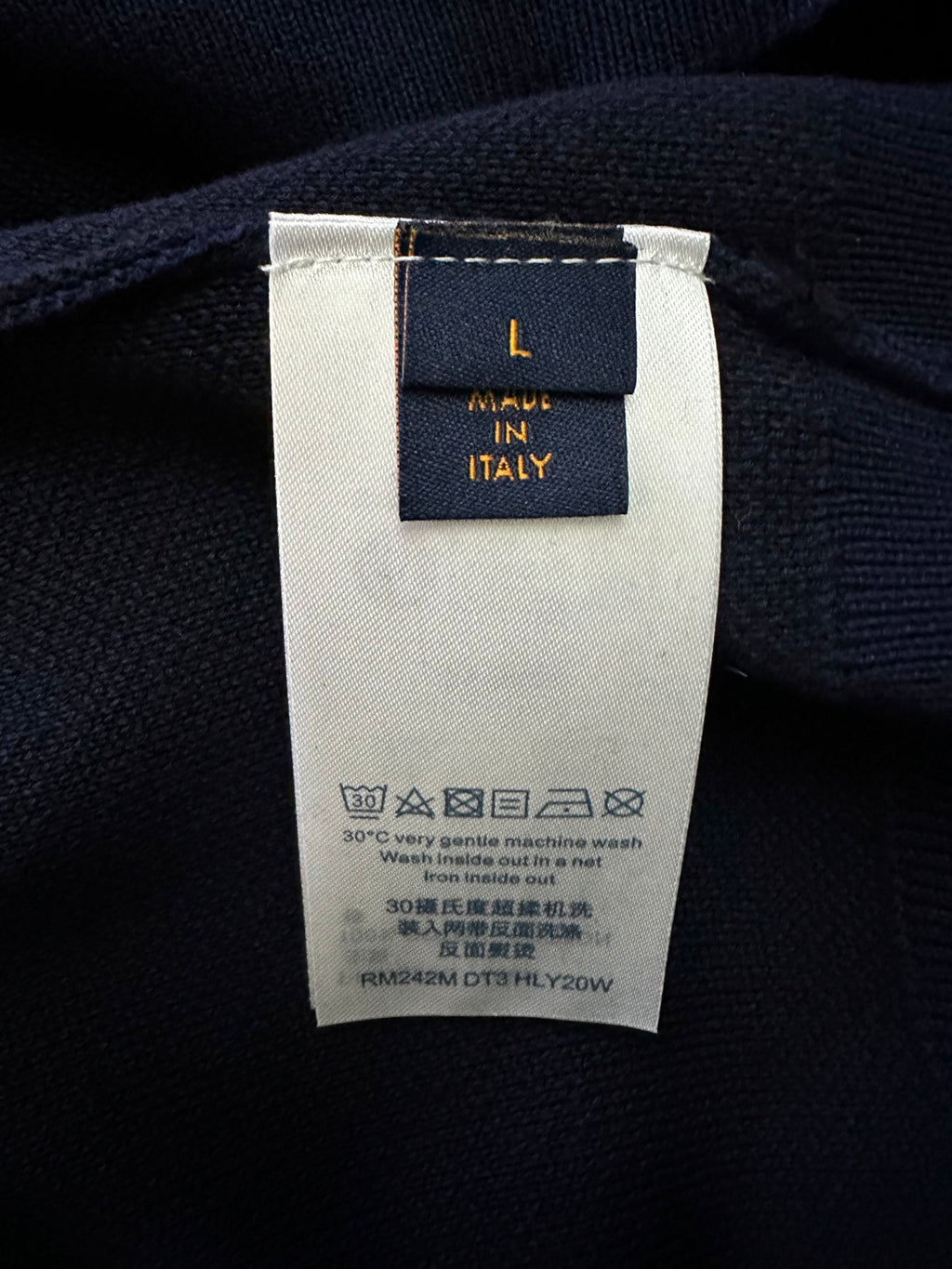 Inside neck label on Louis Vuitton sweater: size and care text