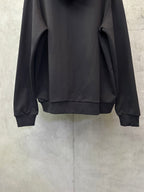 Black long-sleeve hoodie with hood and cuffs, back view