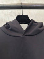 Black hoodie hood and neckline with ribbed texture, close-up