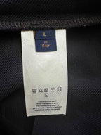 Clothing care label on black hoodie, size L, Italy