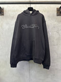 Black long-sleeve hoodie with rhinestone script logo and front kangaroo pocket