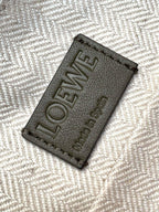Loewe logo leather patch on fabric lining with text LOEWE