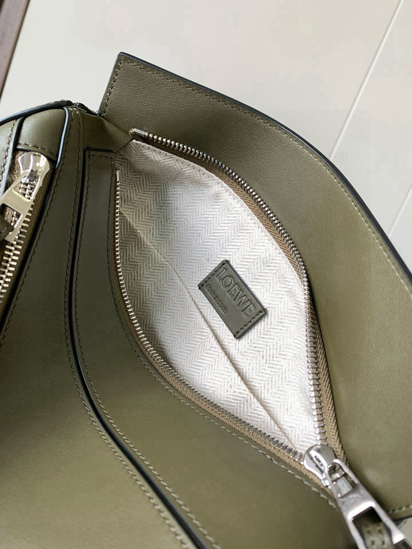 Loewe leather bag open pocket with white patterned lining and top zipper