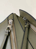 Loewe bag interior view with two zippers, olive green leather and silver hardware