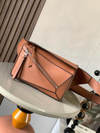 Loewe bag in peach leather with top handles and side zipper panel