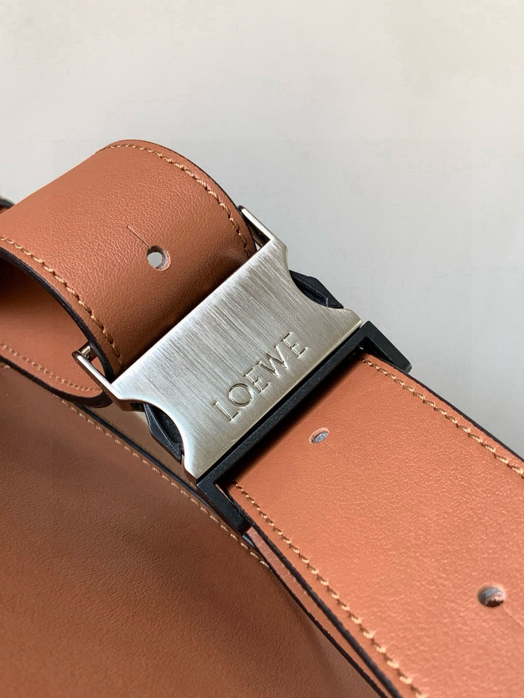 Loewe peach leather bag belt clasp with engraved metal buckle and stitched strap