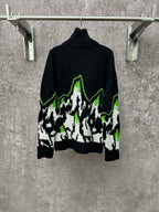 Gucci black knit sweater with white and neon green mountain graphic, ribbed high neck