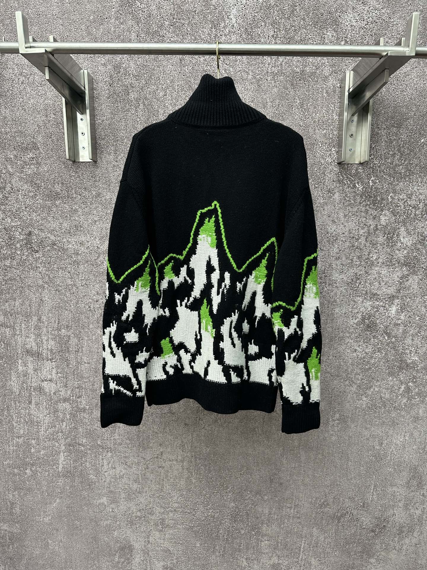 Gucci black knit sweater with white and neon green mountain graphic, ribbed high neck