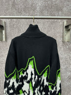Gucci black knit sweater with neon green outlined mountain graphic and ribbed turtleneck