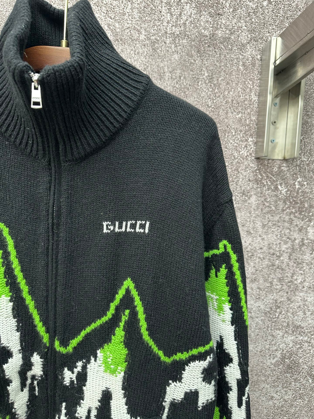 Gucci black knit zip sweater with ribbed collar and small Gucci logo on chest