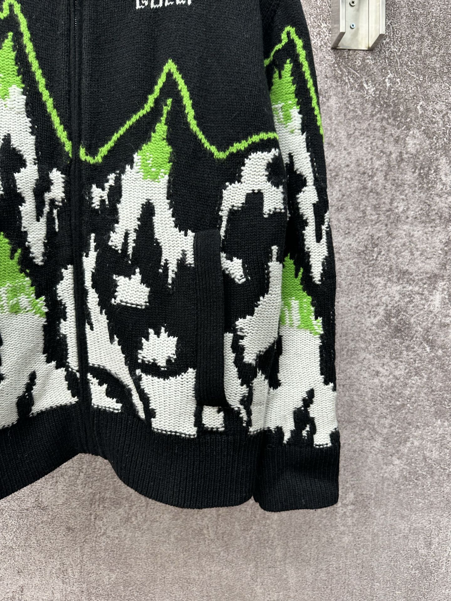 Gucci black knit sweater with white-and-green mountain intarsia and ribbed hem