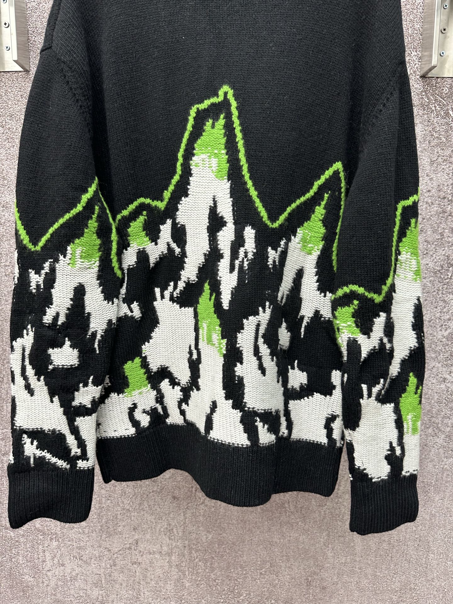 Long knit sweater with black base, neon green and white abstract pattern