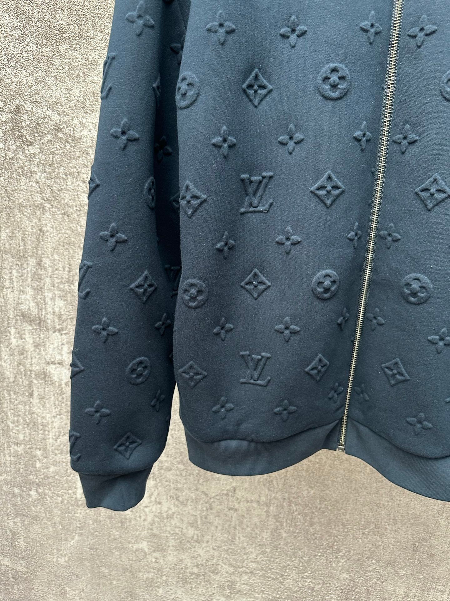 Louis Vuitton long-sleeve zip jacket in dark blue with monogram pattern detail at hem