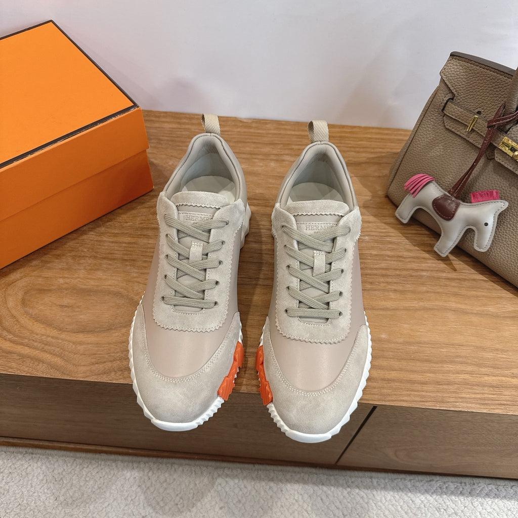 Beige lace-up sneakers with stitched panels and white rubber sole