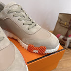 Beige lace-up sneaker upper with textured rubber sole and stitched trim