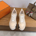 Unisex beige sneakers with white laces and chunky striped sole
