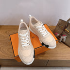 Unisex beige sneakers pair, front view with textured black-and-white heel sole
