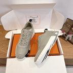 Hermes unisex low-top sneakers in light gray suede, lace-up with contrast sole