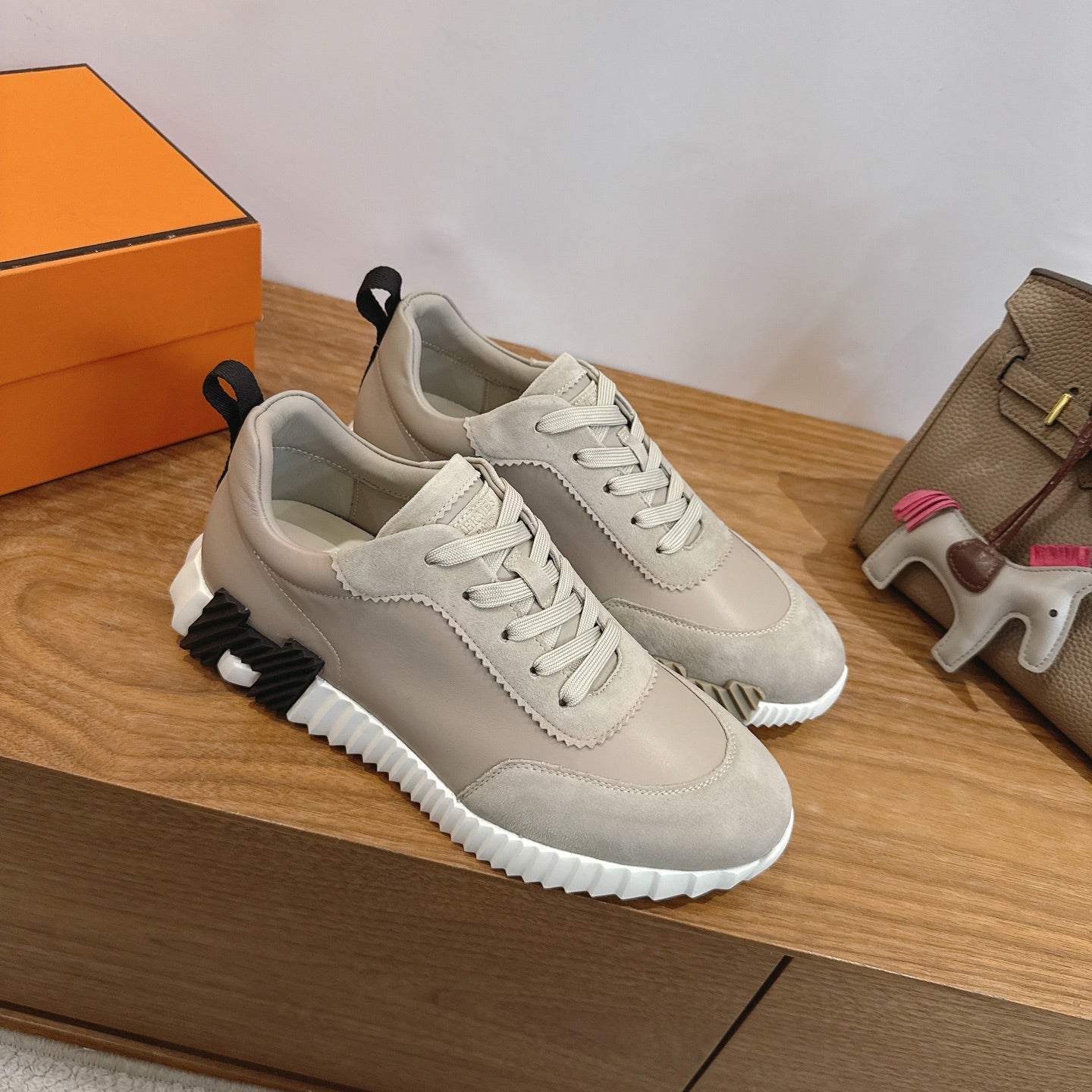 Unisex lace-up sneakers in light beige with textured tread sole, side view