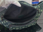 Louis Vuitton monogram bag interior view with zipper opening and dark lining