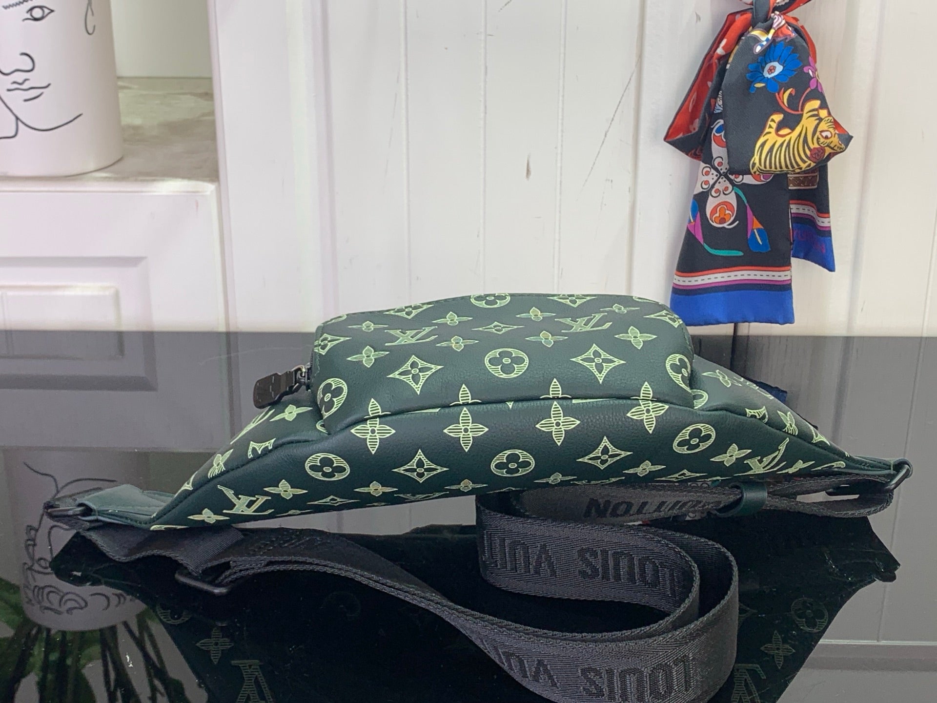 Louis Vuitton monogram bag with strap and visible interior lining